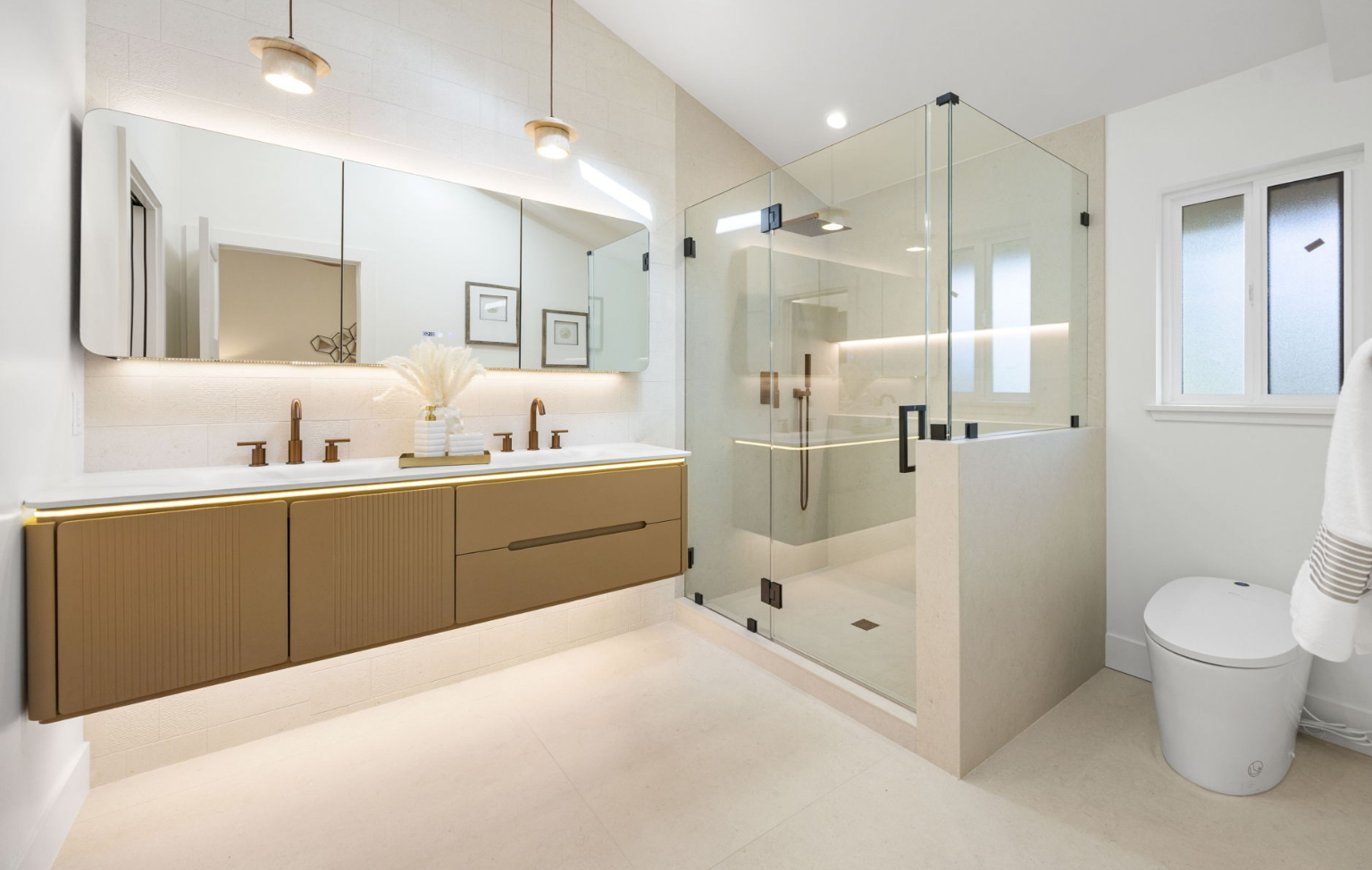 A bathroom with a glass shower and sink, part of a Full Interior-Exterior Home Remodel in Carmel.